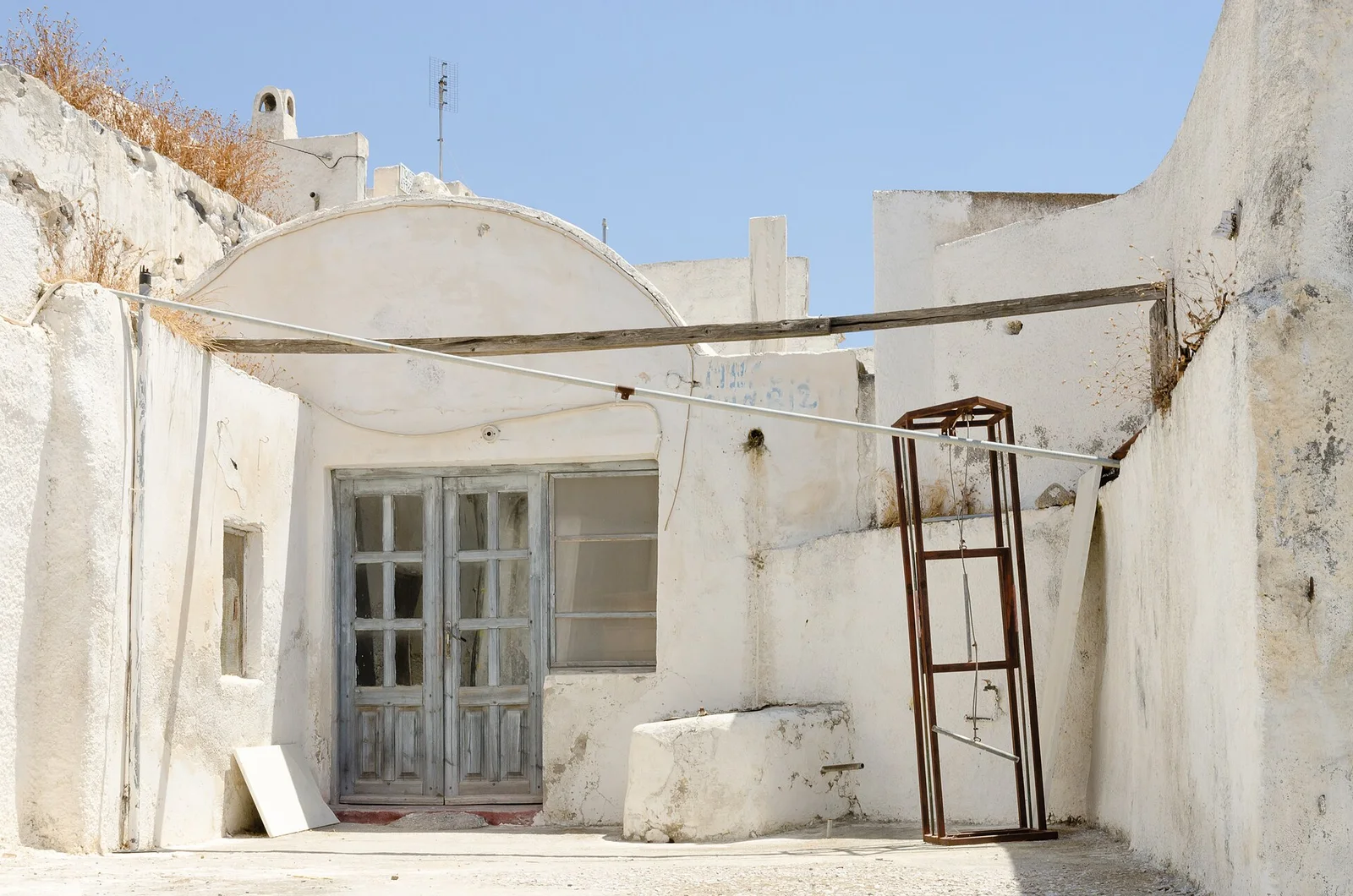 Whitewashed traditional buildings in the old village of Emporio, Santorini